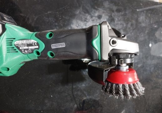 A twisted wire brush attachment for hoof cleaning.
